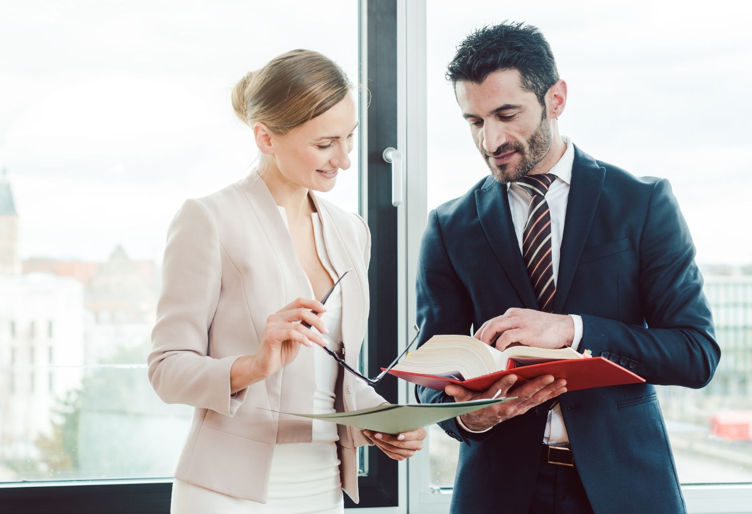 Turkish and central European lawyer in their law firm working in the library representing International Debt Collection Law Firms