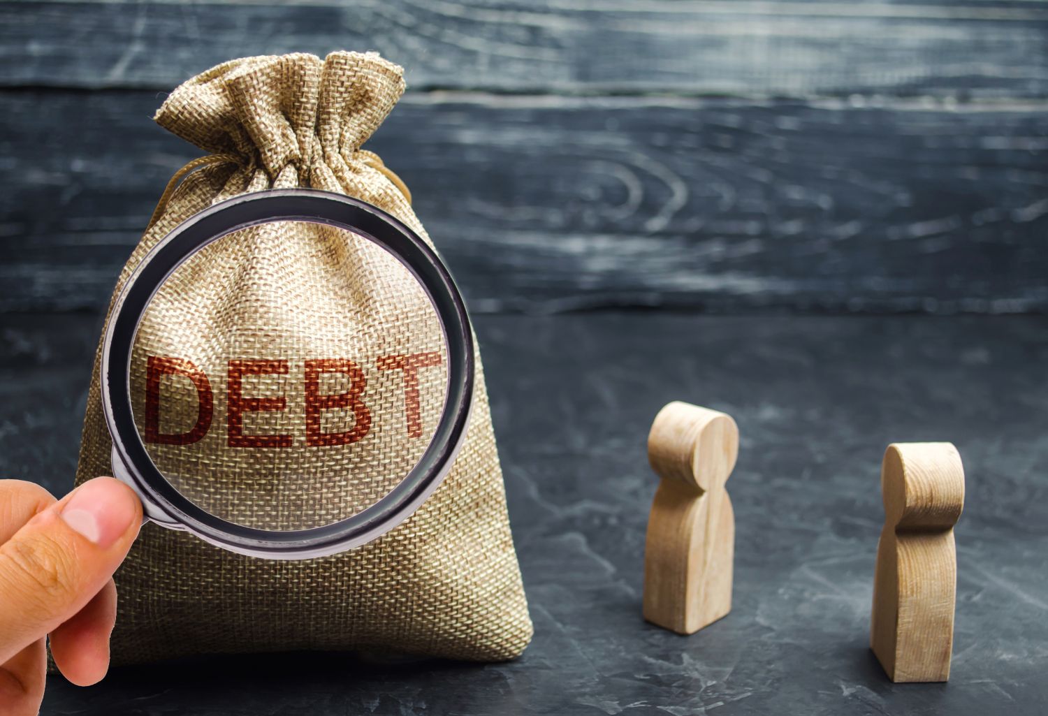 Debt Collection for Manufacturing Companies: Two businessmen discussing debt in a company. Financial debt concept. Company secured and unsecured debt. Concept of debt payment deadline. dividing companys total liabilities by its stockholders